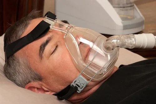 Man with sleep apnea appliance